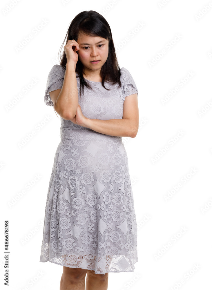 Portrait studio cutout isolated full body shot of Asian young happy trendy female model in beautiful gray lace dress standing posing holding hand on waist smiling look at camera on white background Portrait studio cutout isolated full body shot of Asian young happy trendy female model in beautiful gray lace dress standing posing holding hand on waist smiling look at camera on white background