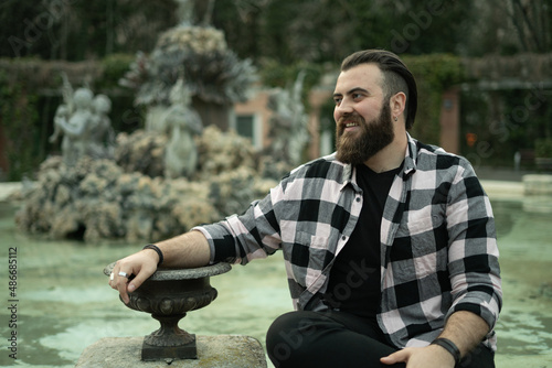 Hombre español con barba y camisa de leñador americano, fuerte, rudo, campechano photo