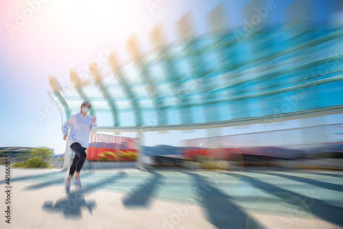 Running girl in city wearing a mask - coronavirus concept