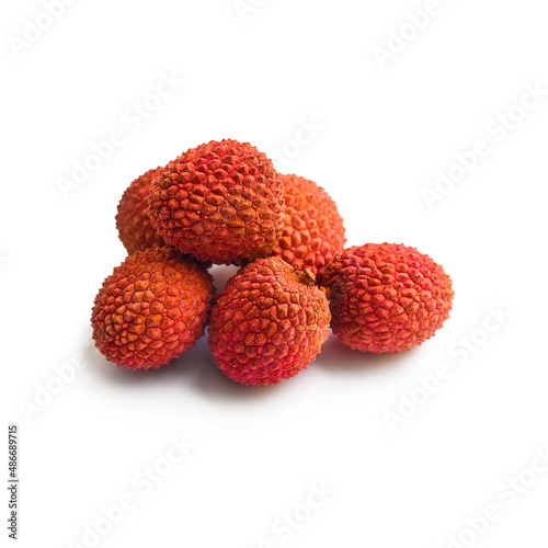 ripe unpeeled lychees isolated on white background