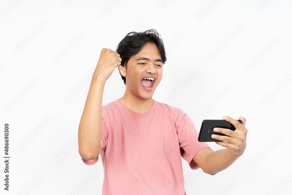 Playing Games On Smartphone Of Asian man Isolated On White Background Playing Games On Smartphone Of Asian man Isolated On White Background