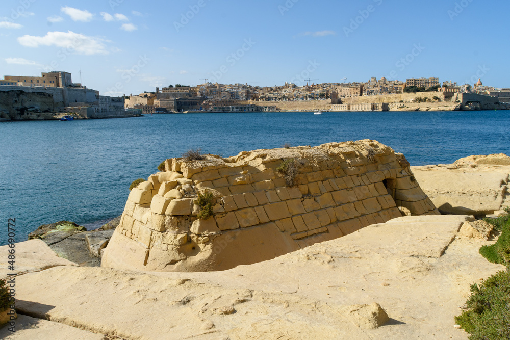 One of the thermal baths in Kalkara on the shore of the Grand Harbour used for treating British servicemen. In the background is Fort St. Angelo and the city of Valletta.
