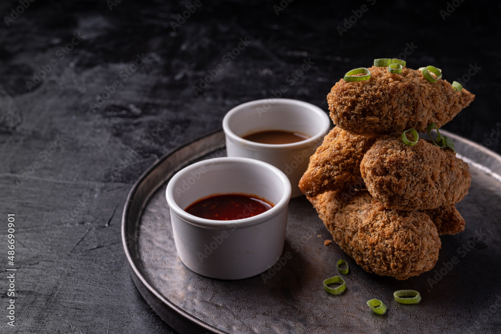 Asian fusion vegan meatfree jackfruit drumsticks with sweet hot sesame