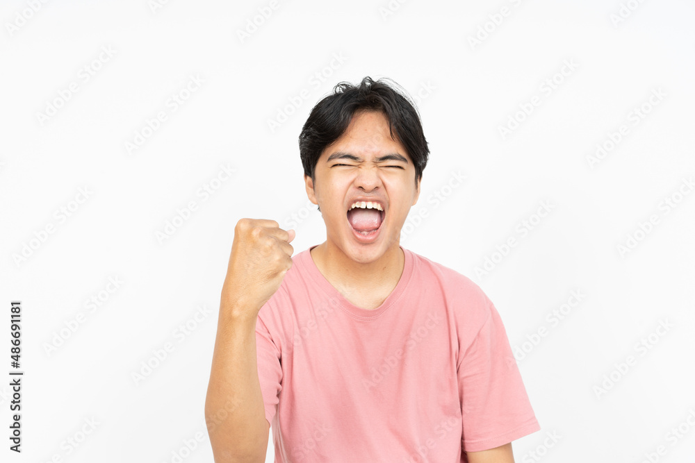 Victorious man. An asian man with t-shirt and white background. Victorious man. An asian man with t-shirt and white background.