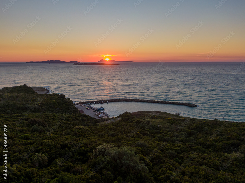 Aerial drone view of Agios Stefanos Marina  with Diapontia Islands corfu , Greece in sunset 