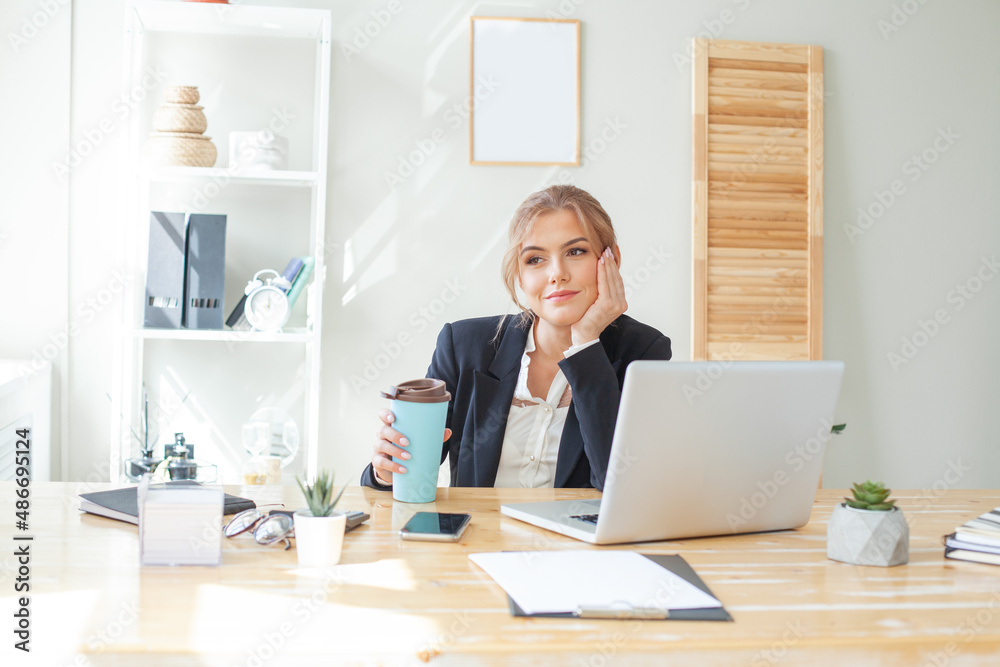 Businesswoman dreaming in her office. Vacation anticipation Businesswoman dreaming in her office. Vacation anticipation