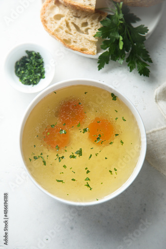 Traditional homemade chicken stock with vegetables