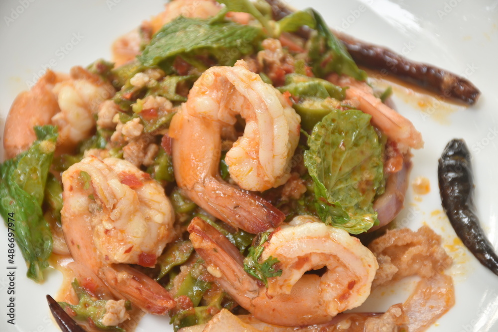 spicy and sour wing bean slice with chop pork topping boiled shrimp Thai salad on dish spicy and sour wing bean slice with chop pork topping boiled shrimp Thai salad on dish