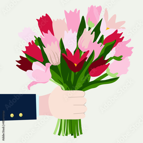 bouquet of tulips in hand