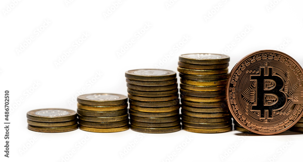 Stack of coins and a bitcoin. Crypto currency investment concept Stack of coins and a bitcoin. Crypto currency investment concept