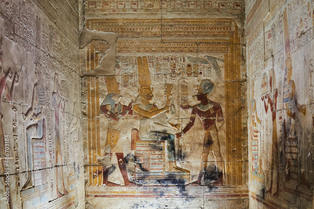 A colourful wall painting with Seti I presenting offerings to the gods, Abydos, Egypt