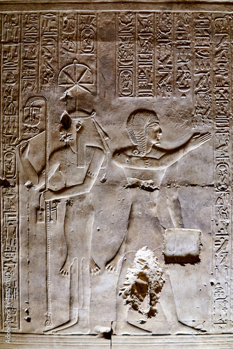 Ancient Egyptian wall carving from Abydos, depicting goddess of writing Seshat and the young Seti I