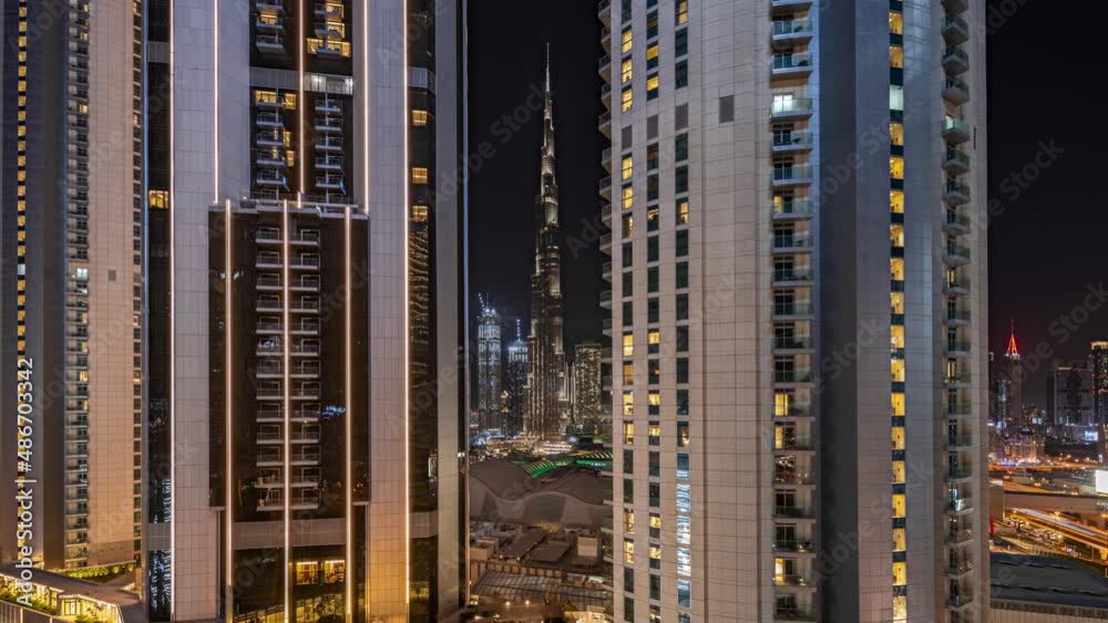 Tallest skyscrapers in downtown dubai located on bouleward street near shopping mall aerial night timelapse. Tallest skyscrapers in downtown dubai located on bouleward street near shopping mall aerial night timelapse.
