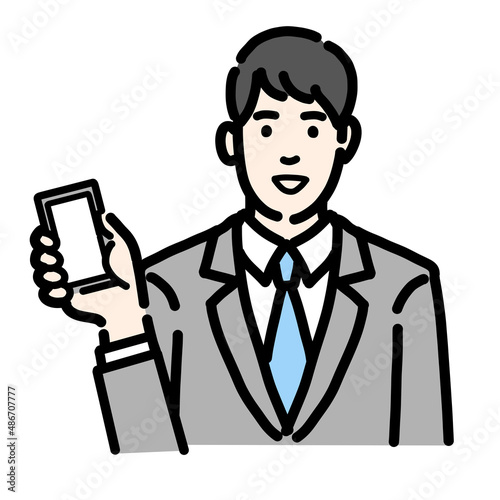 スマートフォンを持っているスーツを着た若い男性のバストアップ