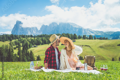 Happy couple on vacation on the italian dolomites mountains. Concept about wanderlust travels and vacation photo