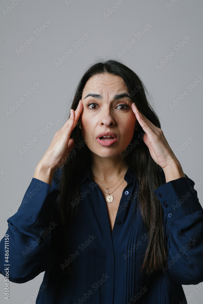 Middle age woman afraid and shocked with surprise and amazed expression. Middle age woman afraid and shocked with surprise and amazed expression.