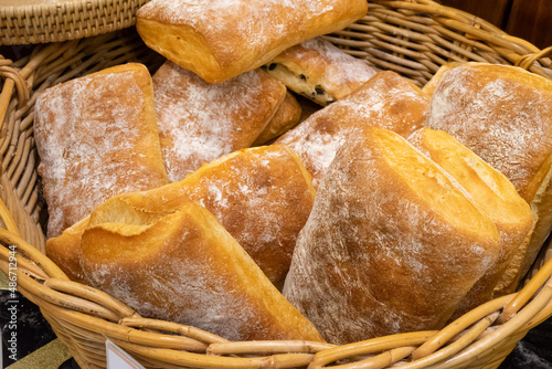 Close up photo of bread (Ciabatta) piled in a basket