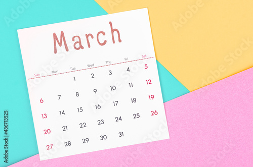 March 2022 calendar on multicolored background.