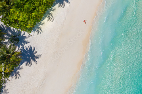Canvastavla Aerial view of a woman relaxing on tropical beach Maldives islands