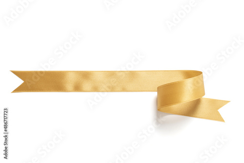A roll gold ribbon isolated on white