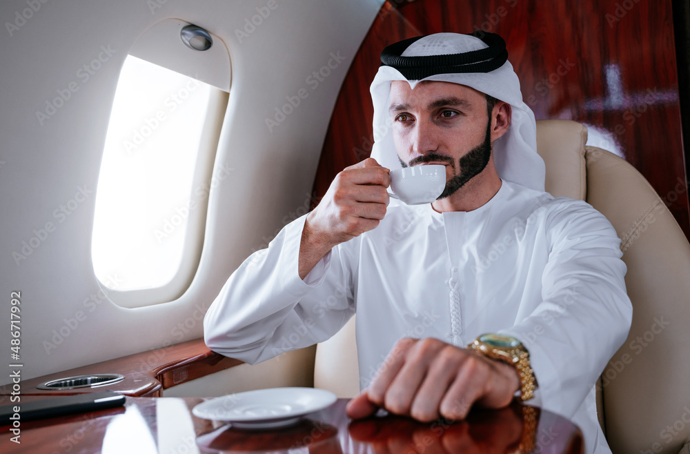 Business man from united arab emirates flying on his private jet to Dubai. Successful speaker