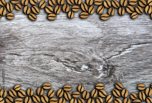 many roasted coffee beans ornament on a wooden background illustration