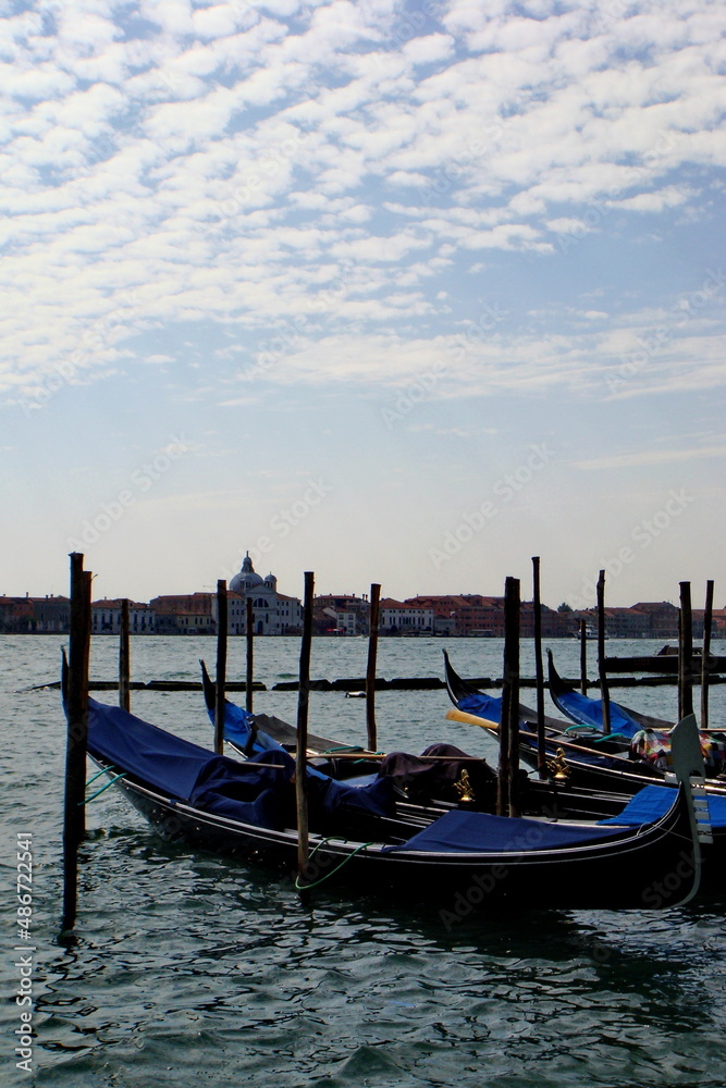 Venetian empty gondolas in a lagoon
