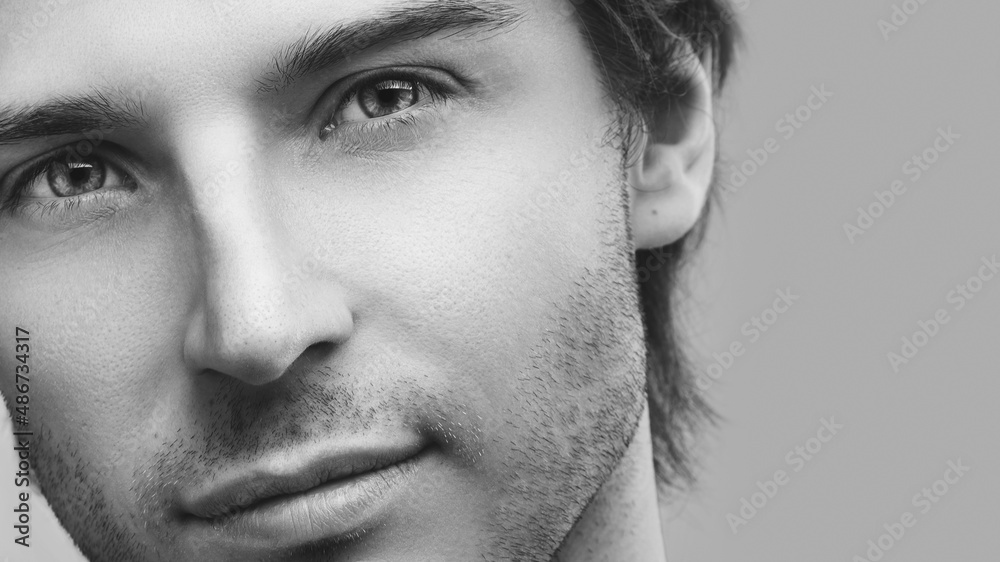 Naklejka premium Young handsome man with a stubble beard