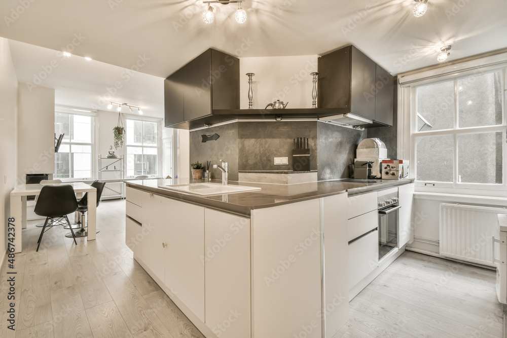 compact white and black kitchen in a small room Stock Photo | Adobe Stock