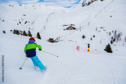 Boy skier enjoys the winter ski resort.