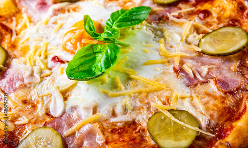 Pizza o sole mio with baked egg and ham. Italian pizza photo