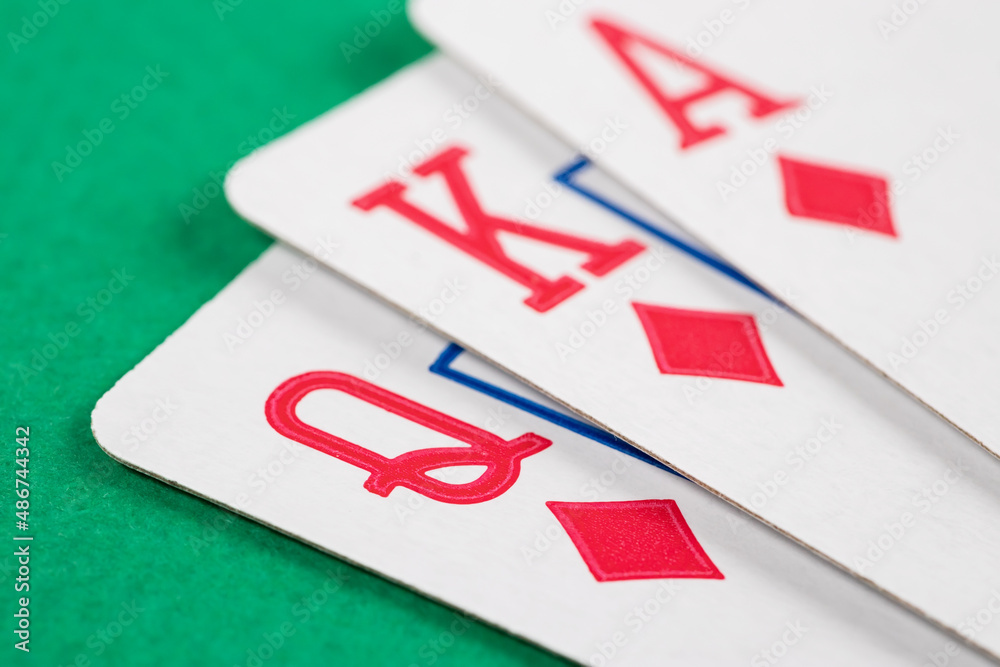 Playing cards on green background. macro Playing cards on green background. macro