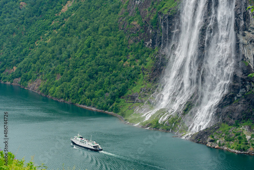Obraz na plátně Ferry passing the famous Seven Sisters waterfall in the Geiranger Fjord, Norway