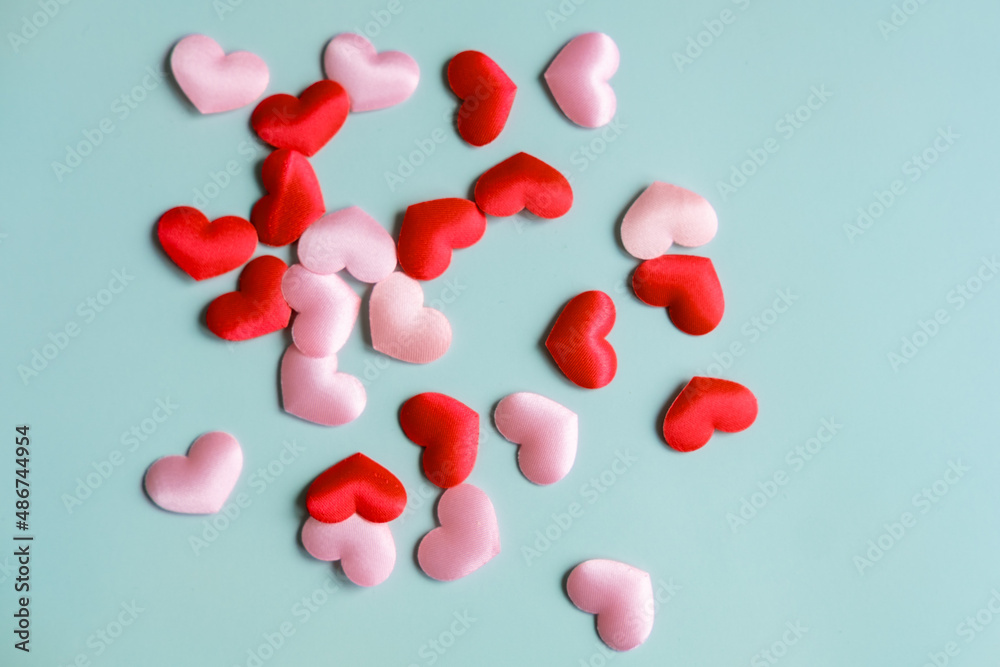 Valentine's Day background. White and red hearts on pastel blue background, top view, copy space. Valentines day concept.