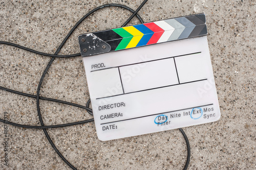 Filming on location. Empty blank clapperboard. Film process