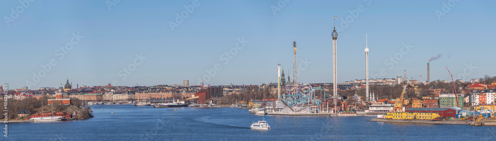 Panorama harbor view, castle, amusements parks and museums around the Baltic side bays a sunny winter day in Stockholm