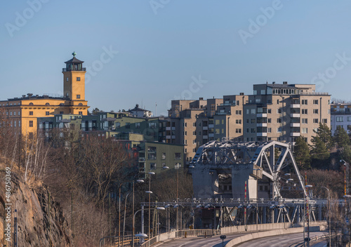 Photography Apartment house on the hill at the district Finnboda, a counterweight bridge wit