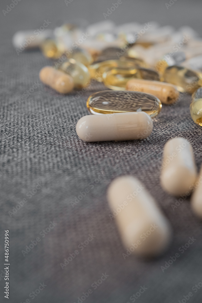 Vitamins and dietary supplements close-up. Macrophoto of capsules. Vitamins on the table. Vitamins and dietary supplements close-up. Macrophoto of capsules. Vitamins on the table.