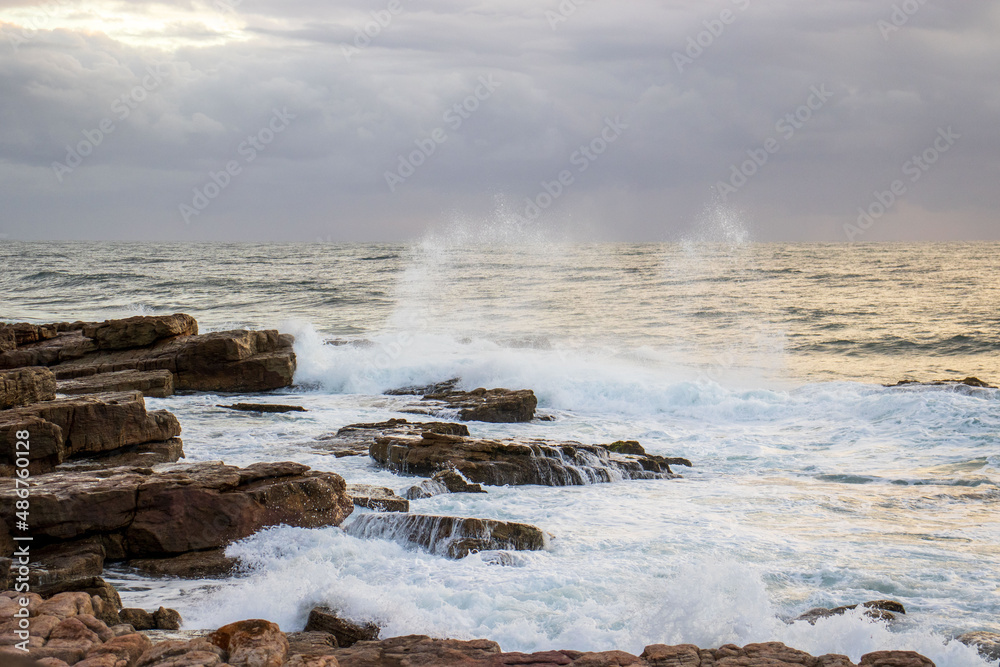Waves crashing onto rocks on the south coast of South Africa Waves crashing onto rocks on the south coast of South Africa