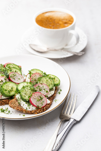 Keto Toasts with cucumber, egg, mozzarella and microgreens.