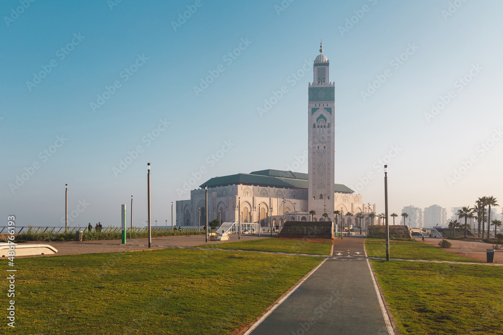 view of Hassan II Mosque from the alley in a bright day - Casablanca, Morocco