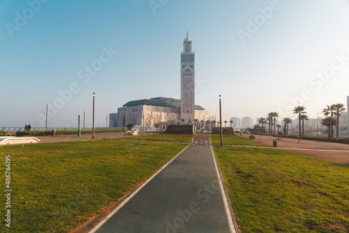 view of Hassan II Mosque from the alley in a bright day