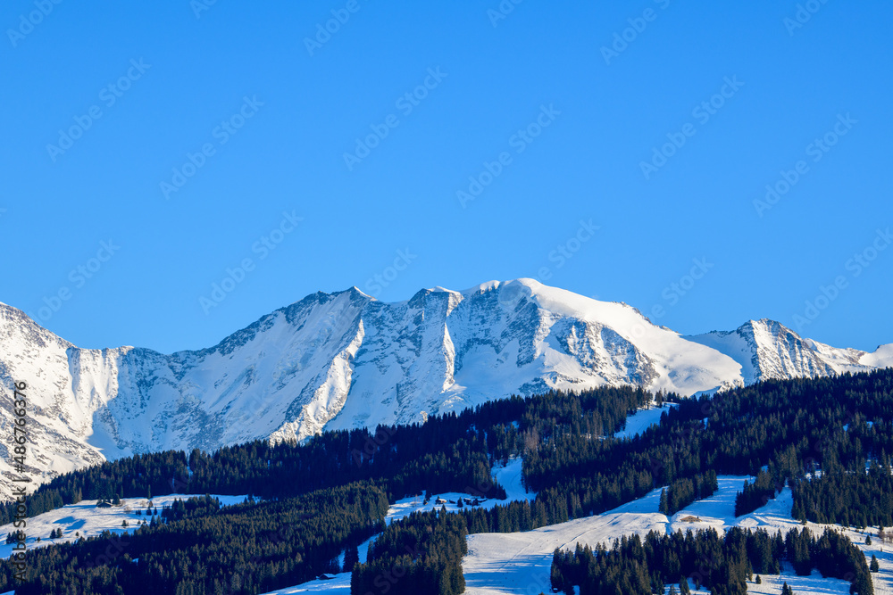 The Domes de Miage in the Mont Blanc massif in Europe, France, Rhone Alpes, Savoie, Alps, in winter on a sunny day.