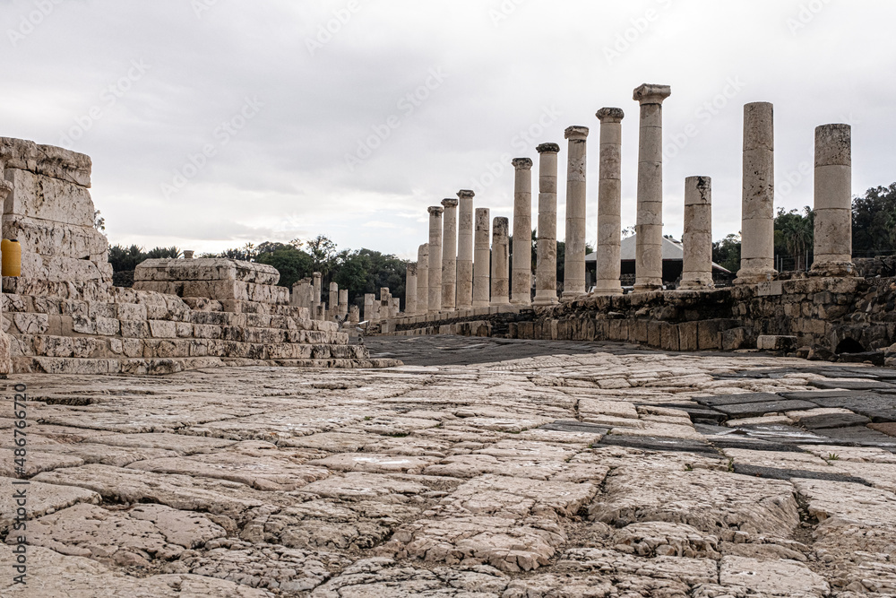 View of the Cardo, the main street with a row of columns in the Ancient Roman city in Beit Shean Nationl Park, Jordan Valey, Northern Israel, Israel	