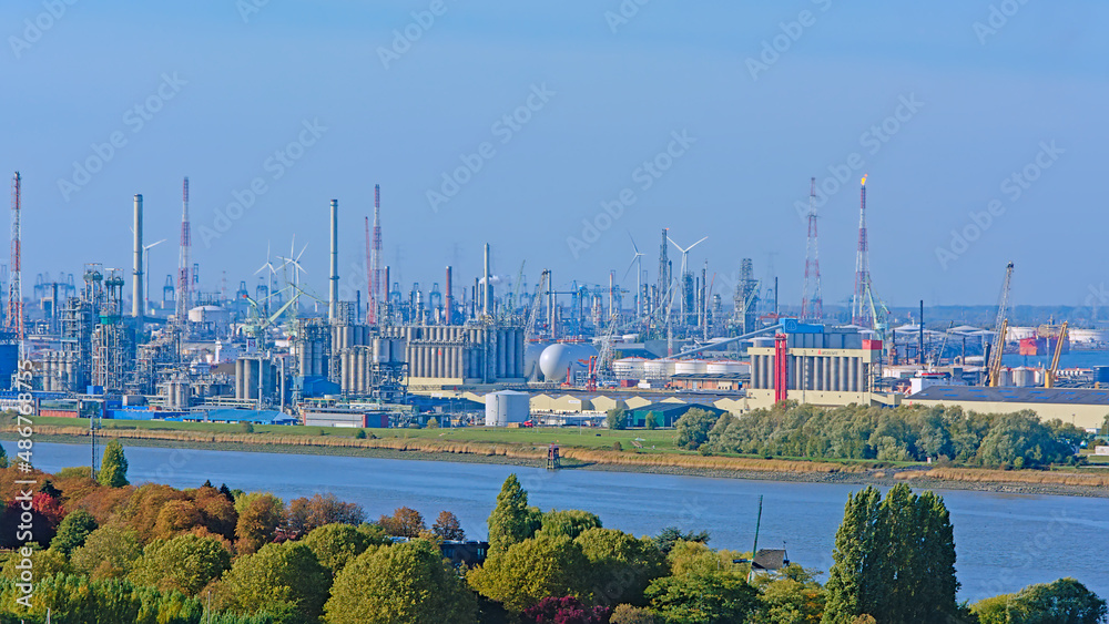 Obraz premium Aerial view on petrochemical industry infrastructure along scheldt river in the port of antwerp, Flanders, Belgium 