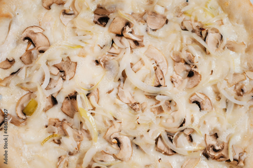 Pizza with onion cheese and mushrooms close-up.