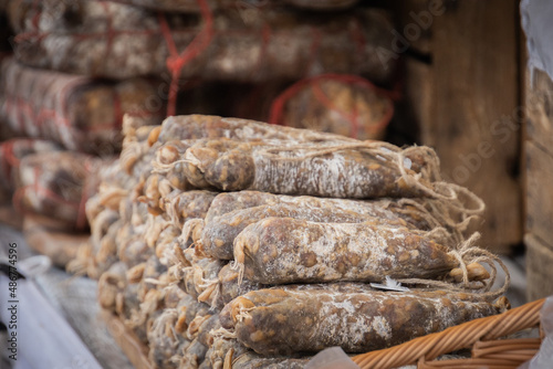 heap of cured sausages in the market