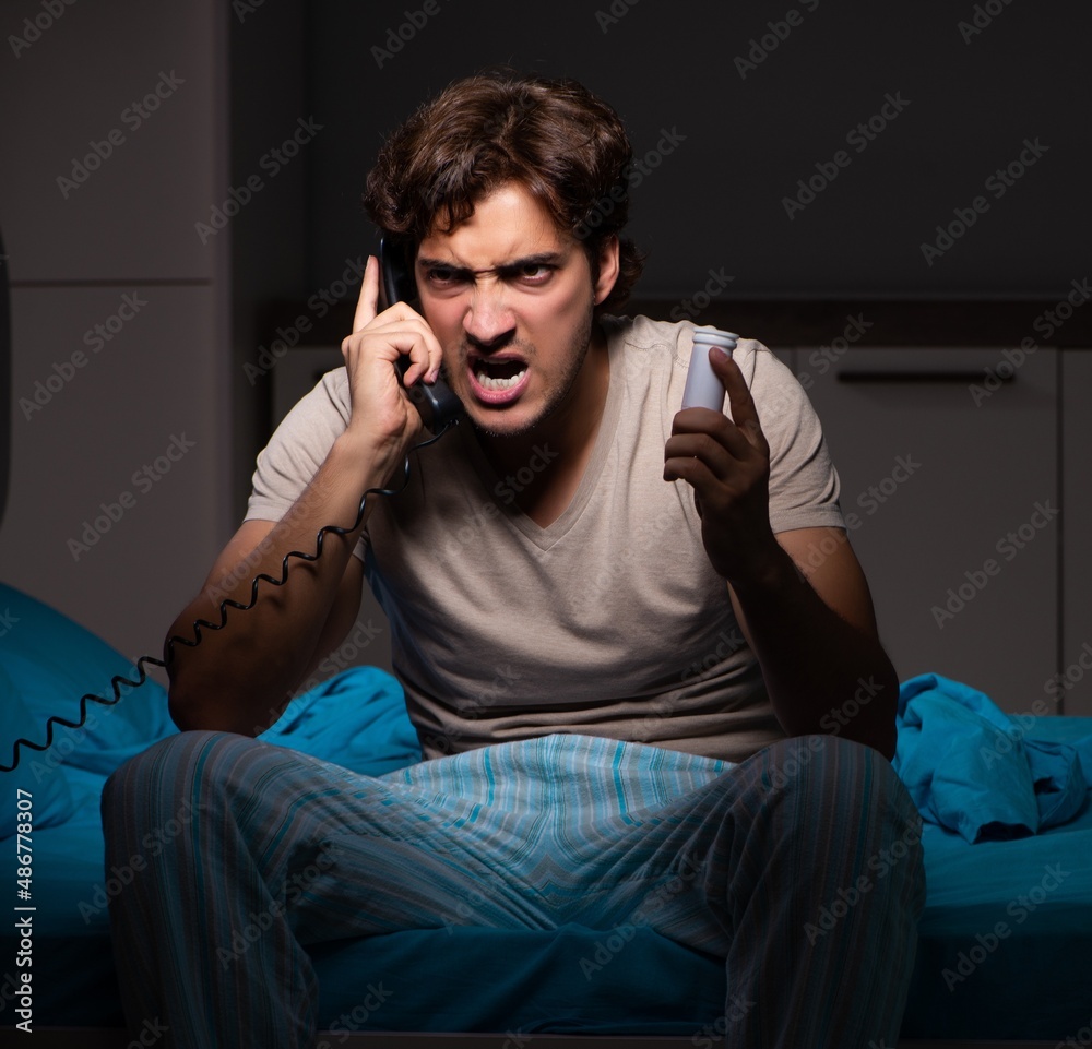 The sick man in his bed with medicines