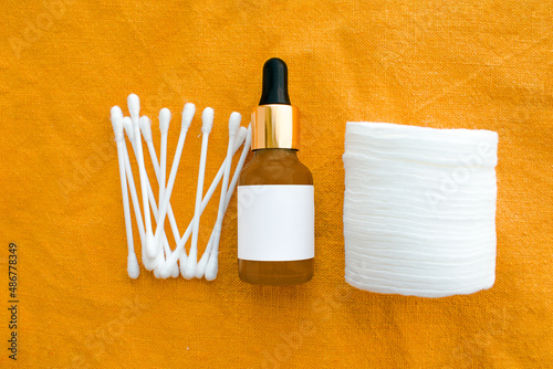 mockap. cosmetic dark amber glass bottles on white background. Closeup, copyspace. Beauty blogging, salon treatment concept, minimalism brand packaging mock up photo