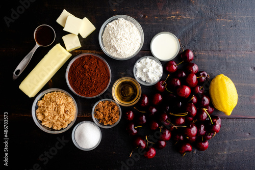 Ingredients for Bourbon Cherry Chocolate Galette: Fresh cherries, cocoa powder, and other ingredients for baking a dessert